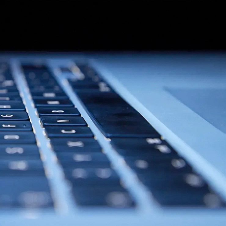 A keyboard with blue illumination